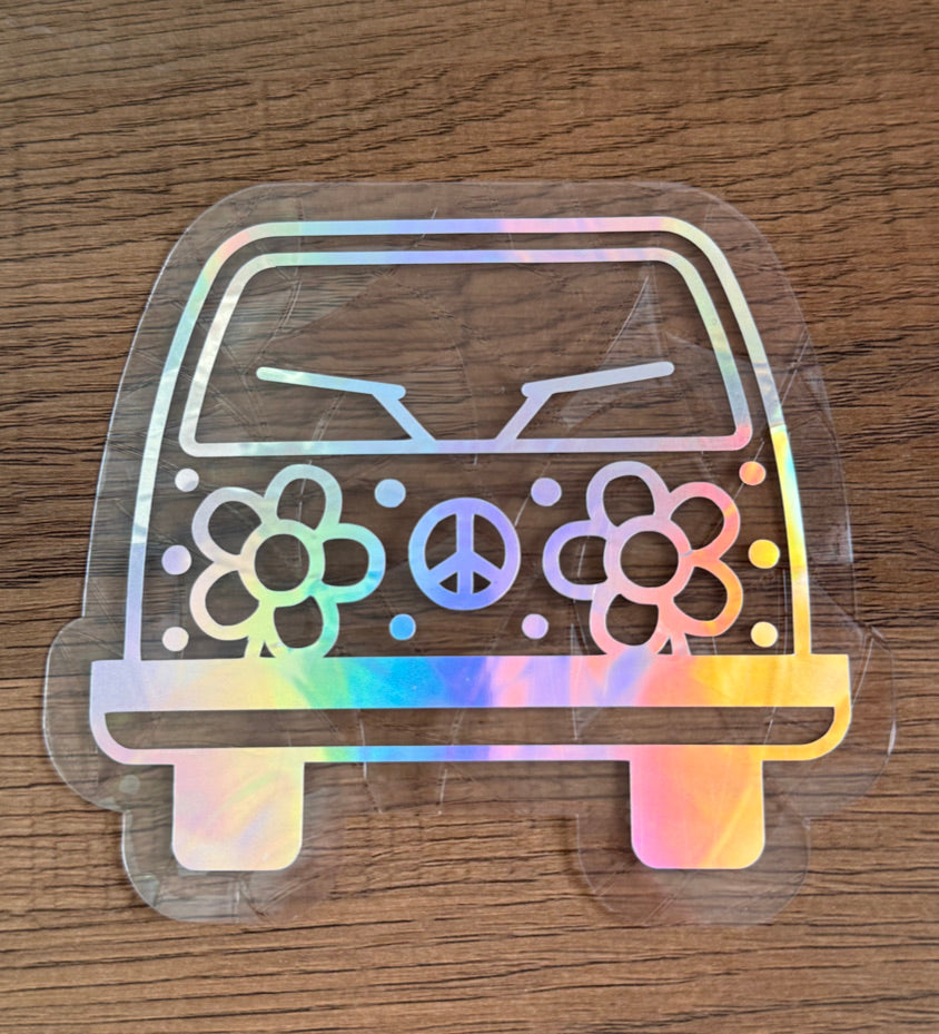 Retro flower van rainbow window cling creating colorful prism reflections on a sunny window