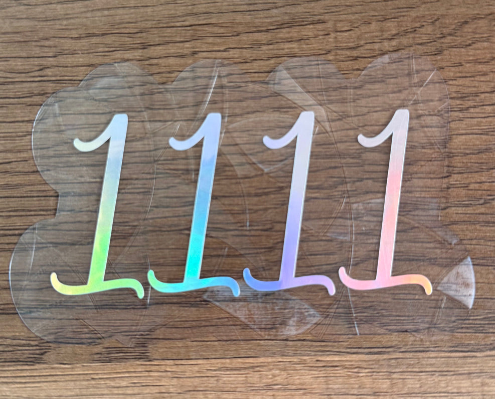 1111 angel number rainbow window cling creating colorful light reflections on a window