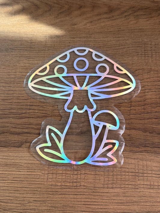 Mushroom rainbow window cling creating colorful prism rainbows on a sunny window