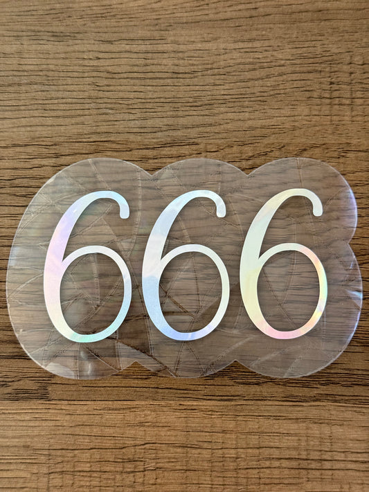 666 angel number rainbow window cling creating colorful prism reflections on glass