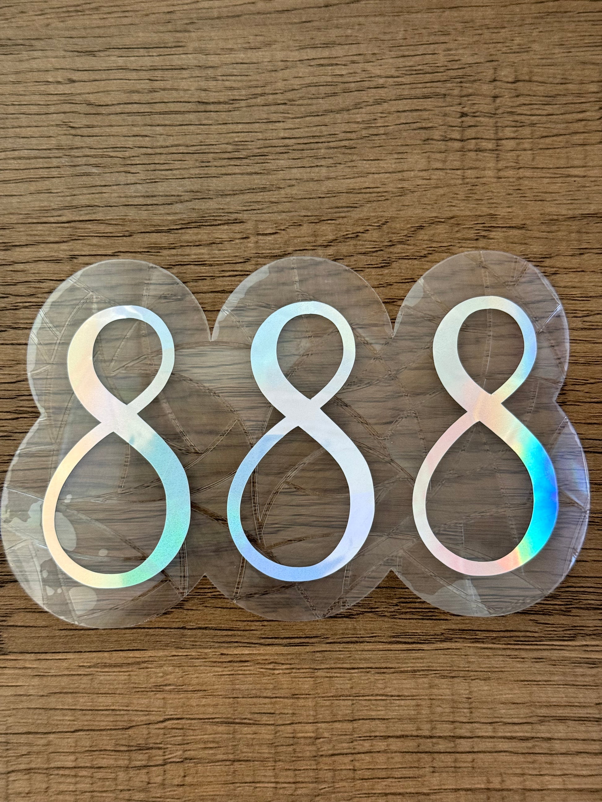 888 angel number prism window cling creating colorful rainbow reflections indoors